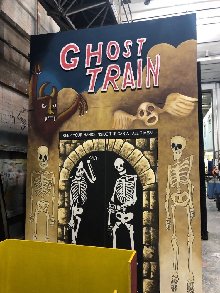 Flat for a ghost train entrance, with skeletons and text painted on
